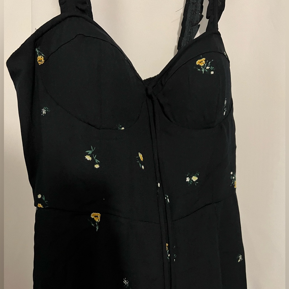 Black romper with floral details